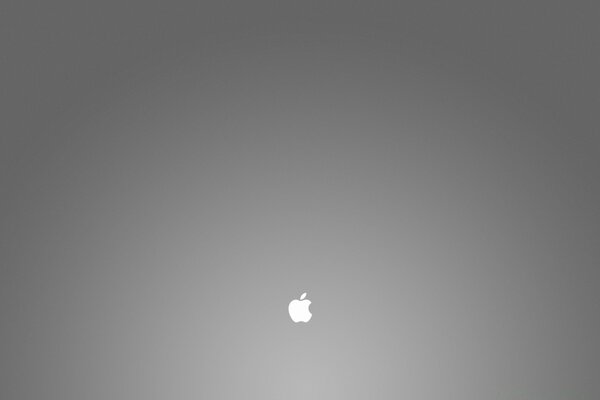 Apple Apple muito pequena em um fundo cinzento